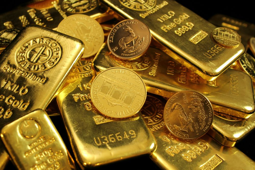 Mélange de pièces et de lingotins d'or de différents pays Canada, Australie etc..